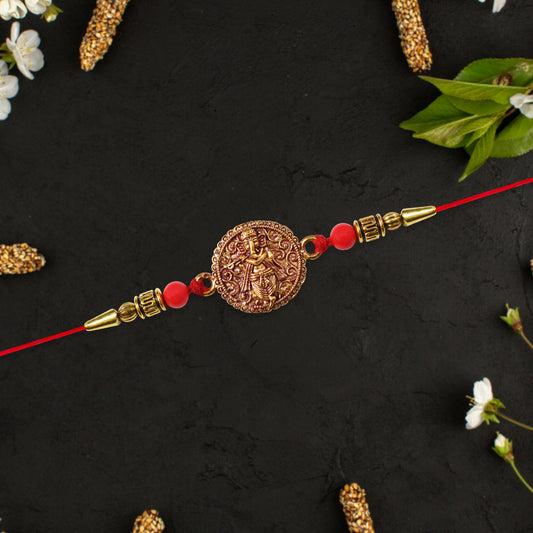 Antique Ganesha Coin Rakhi With Red Beads