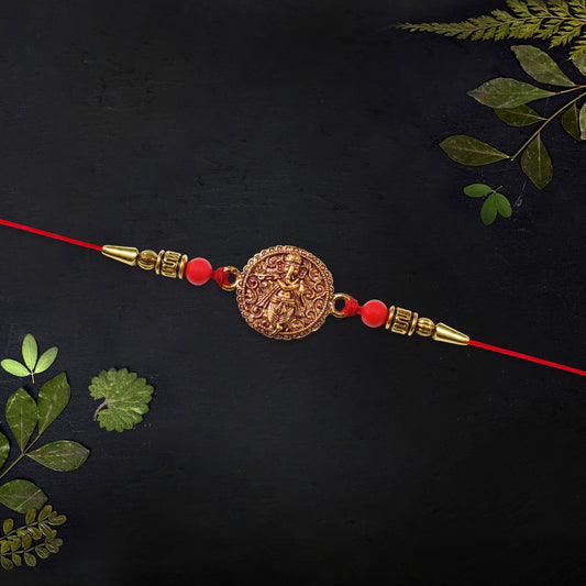 Antique Ganesha Coin Rakhi With Red Beads