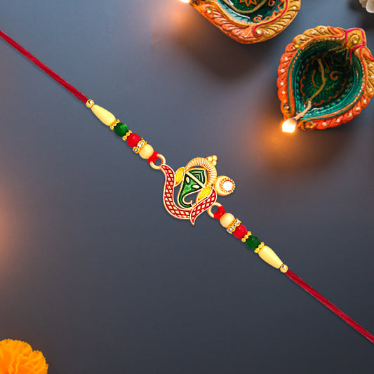Green Enamel Lord Ganesha Rakhi With Decorative Red Thread And Golden Accents